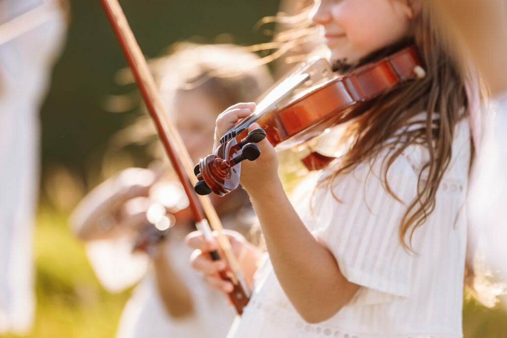 A young little girl playing outdoor during the summer festival